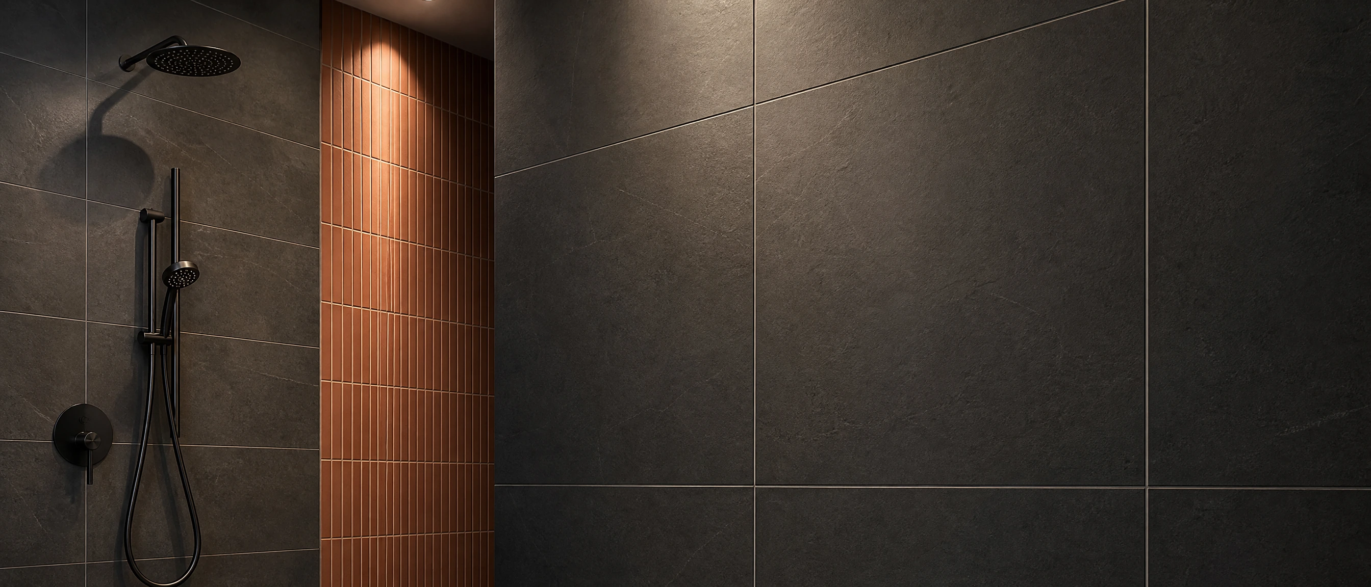 Dark porcelain shower tiles with a terracotta ceramic feature strip